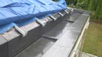 Lead gutter and welted parapet cover